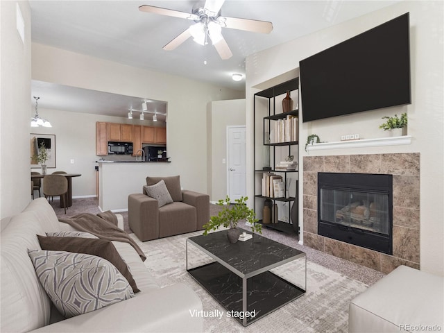 9142 Lodestar Ln Unit 305, Parker, CO 80134 - living room with a fireplace and a ceiling fan
