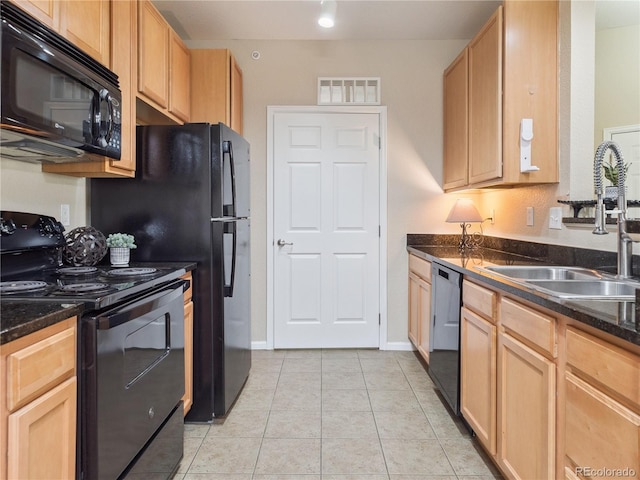 9142 Lodestar Ln Unit 305, Parker, CO 80134 - kitchen with black appliances, light tile patterned floors, and light brown cabinetry