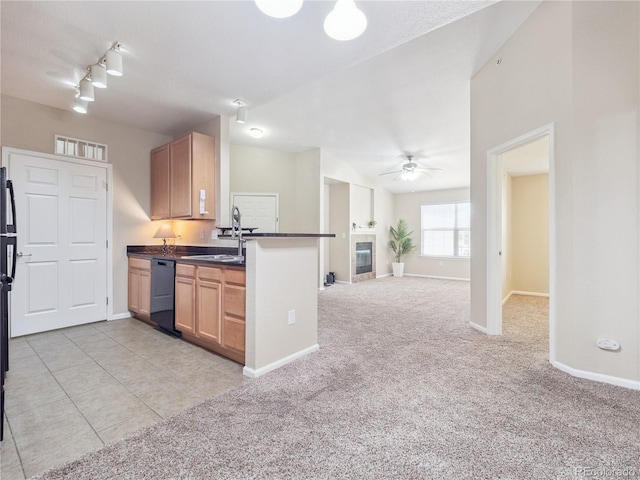 9142 Lodestar Ln Unit 305, Parker, CO 80134 - kitchen featuring dishwasher, dark countertops, light carpet, ceiling fan, and open floor plan