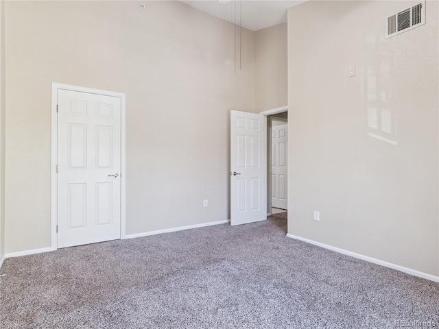 9142 Lodestar Ln Unit 305, Parker, CO 80134 - unfurnished bedroom with a high ceiling and carpet flooring