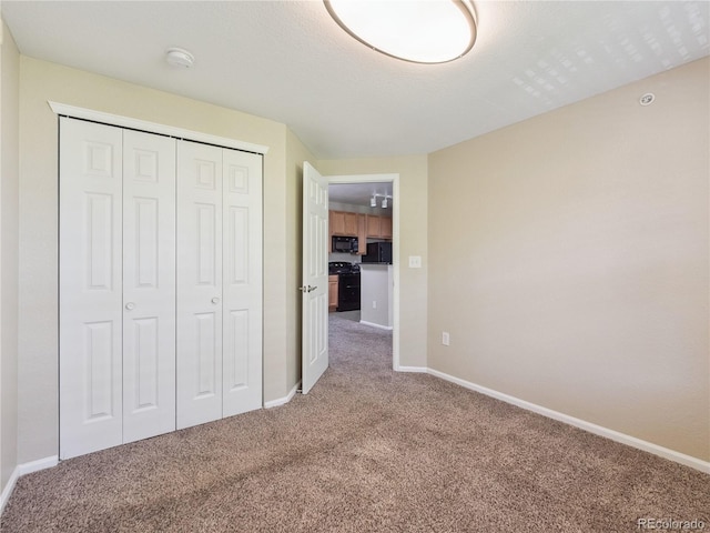 9142 Lodestar Ln Unit 305, Parker, CO 80134 - unfurnished bedroom with carpet floors and a closet