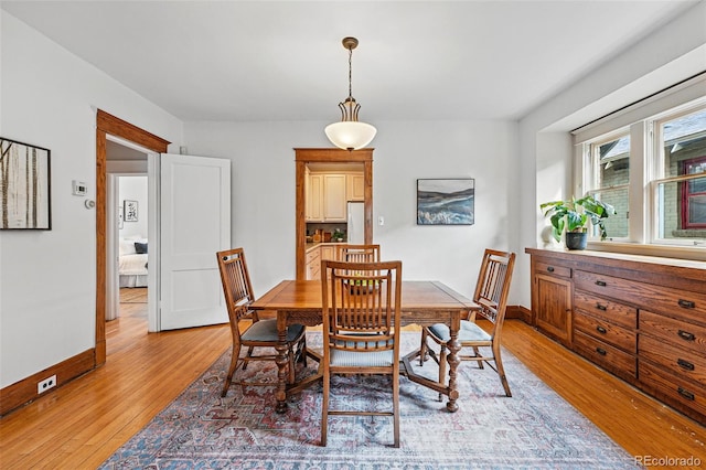 618 Adams St, Denver, CO 80206 - dining space with light wood finished floors and baseboards