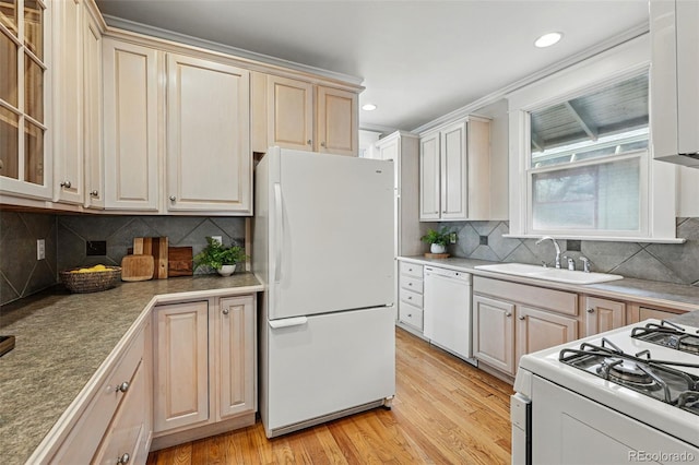618 Adams St, Denver, CO 80206 - kitchen featuring white appliances, a sink, light wood-style flooring, decorative backsplash, and glass insert cabinets