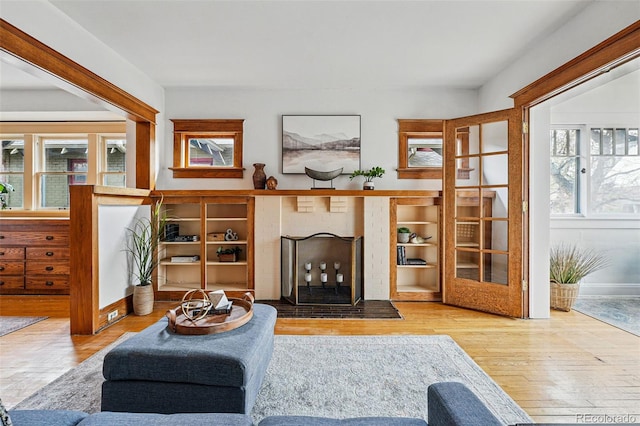 618 Adams St, Denver, CO 80206 - living area with a fireplace, hardwood / wood-style floors, and healthy amount of natural light