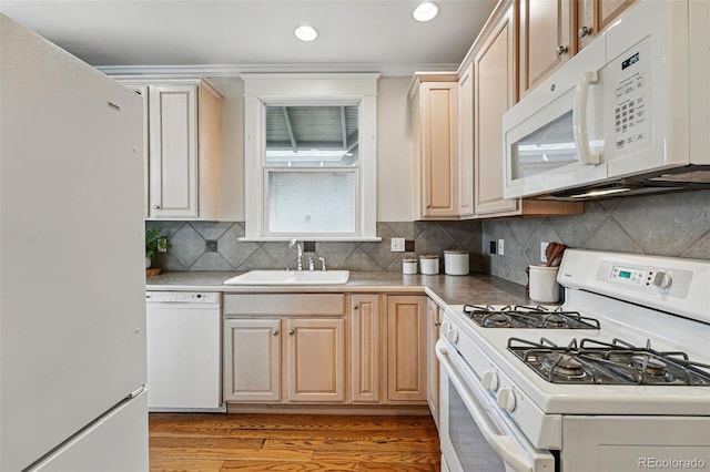 618 Adams St, Denver, CO 80206 - kitchen with white appliances, a sink, light wood-style floors, recessed lighting, and light brown cabinets