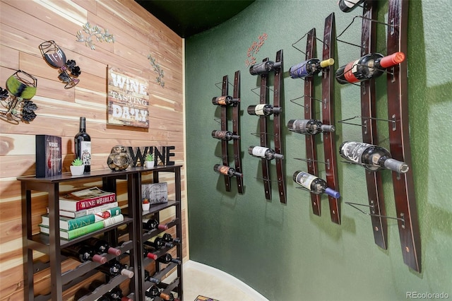 wine area featuring wooden walls