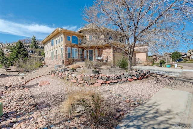 5830 Jasper Pointe Cir, Castle Pines, CO 80108 - back of property with driveway and a garage