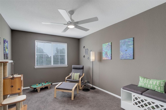 5830 Jasper Pointe Cir, Castle Pines, CO 80108 - sitting room featuring a ceiling fan, baseboards, carpet floors, and a textured ceiling