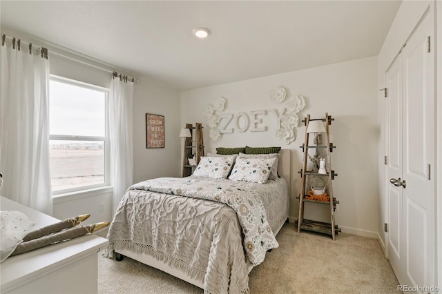 carpeted bedroom with a closet