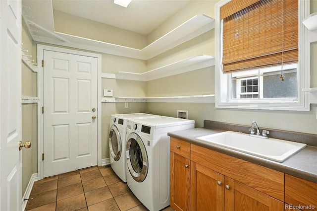 7527 E Severn Pl, Denver, CO 80230 - washroom with tile patterned flooring, separate washer and dryer, and cabinet space
