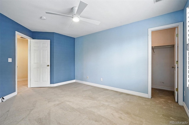 7527 E Severn Pl, Denver, CO 80230 - unfurnished bedroom featuring carpet, a spacious closet, a closet, and ceiling fan