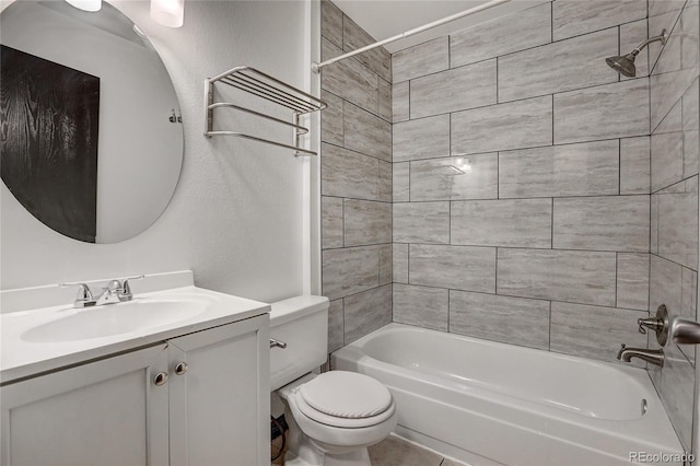 bathroom featuring toilet, shower / washtub combination, and vanity