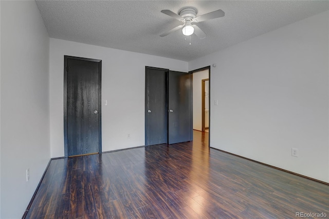 unfurnished bedroom featuring a textured ceiling, wood finished floors, and a ceiling fan