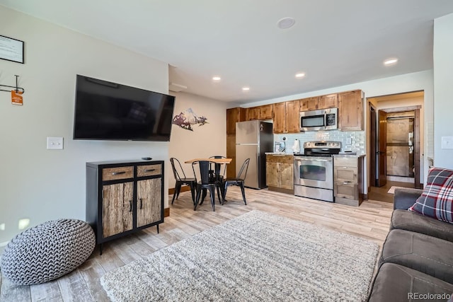 living room with light hardwood / wood-style floors