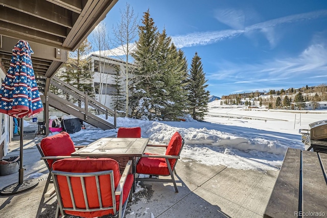 view of snow covered patio