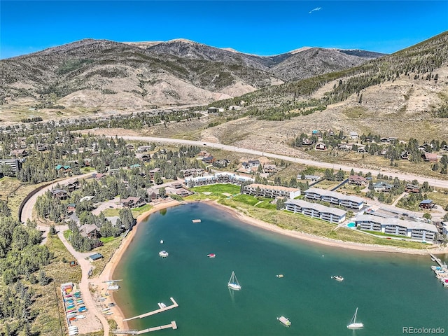 bird's eye view with a water and mountain view