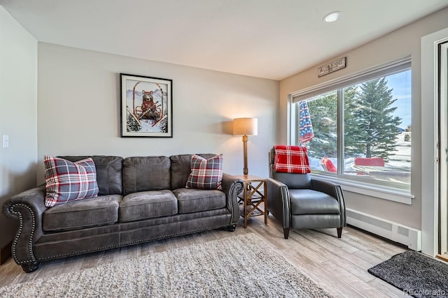 living room with light hardwood / wood-style flooring