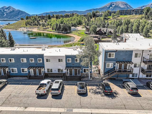 drone / aerial view with a water and mountain view