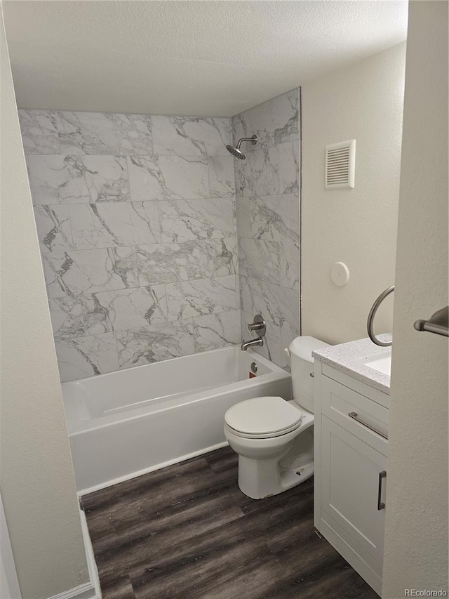 1840 S Pitkin Cir Unit A, Aurora, CO 80017 - bathroom with vanity, shower / washtub combination, wood finished floors, and a textured ceiling
