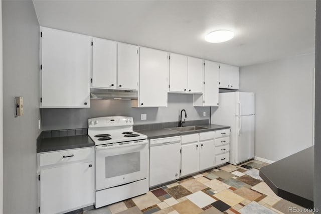 1118 City Park Ave Unit 226, Fort Collins, CO 80521 - kitchen featuring white appliances, under cabinet range hood, a sink, and dark countertops