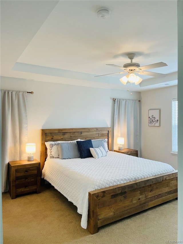 carpeted bedroom featuring ceiling fan