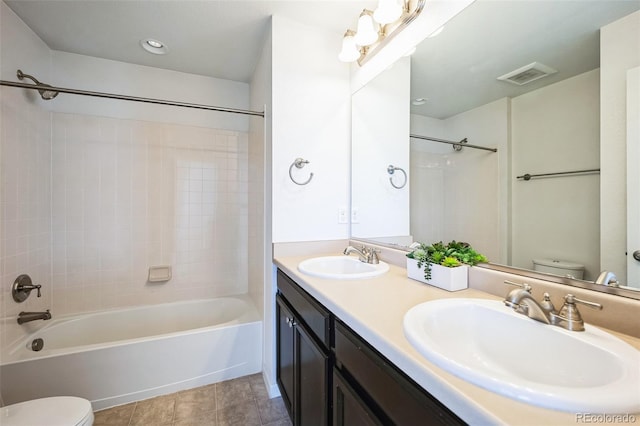 full bath with a sink, visible vents, and toilet