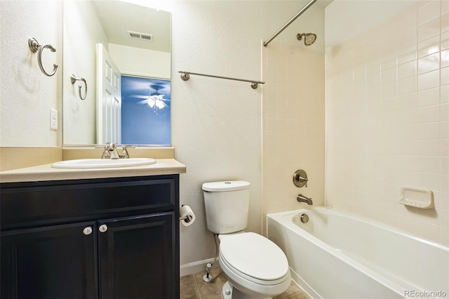 bathroom featuring tile patterned flooring, visible vents, toilet, bathtub / shower combination, and vanity