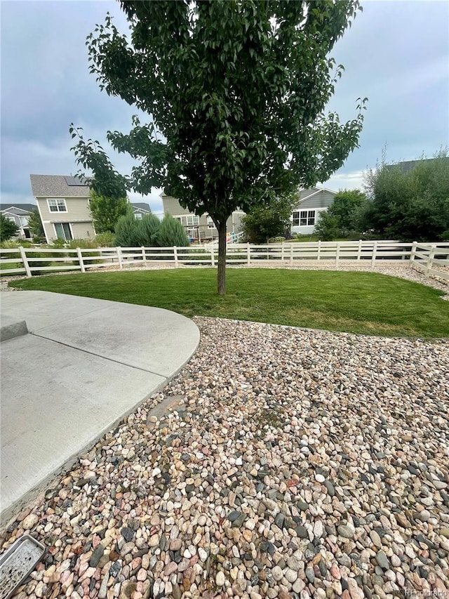 view of yard with a patio and fence