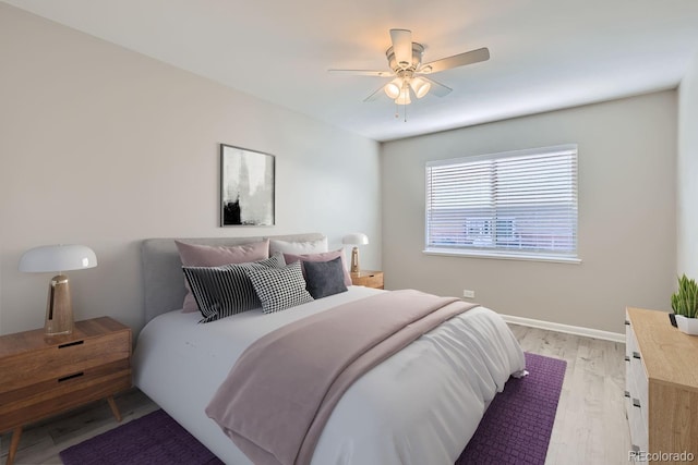 bedroom featuring light hardwood / wood-style floors and ceiling fan