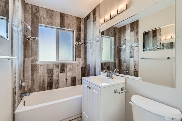 bathroom featuring shower / bath combination, toilet, and vanity