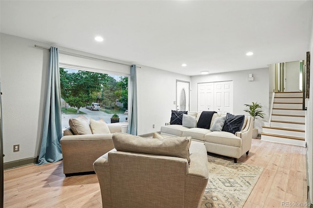 15034 E Floyd Ave, Aurora, CO 80014 - living area featuring light wood-style flooring, stairs, recessed lighting, and baseboards