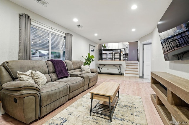 15034 E Floyd Ave, Aurora, CO 80014 - living area with light wood-style floors, recessed lighting, and stairs