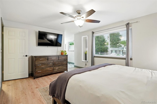 15034 E Floyd Ave, Aurora, CO 80014 - bedroom with light wood-style flooring and ceiling fan