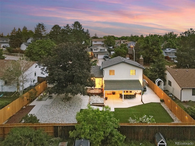 15034 E Floyd Ave, Aurora, CO 80014 - rear view of house featuring a patio, a residential view, and a chimney