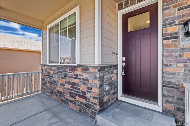 property entrance featuring covered porch