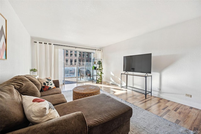 888 N Logan St Unit 5A, Denver, CO 80203 - living area featuring wood finished floors and baseboards
