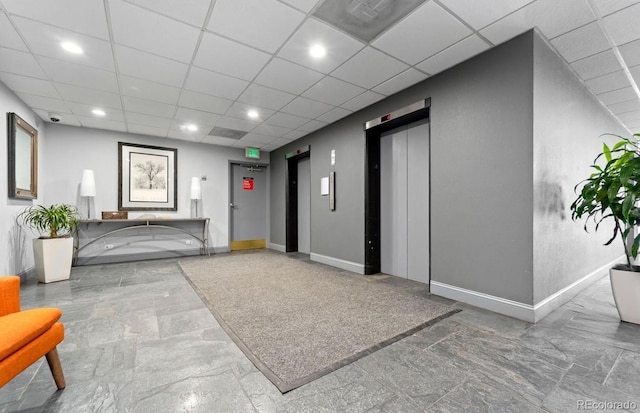 888 N Logan St Unit 5A, Denver, CO 80203 - common area featuring a security system, a drop ceiling, and recessed lighting