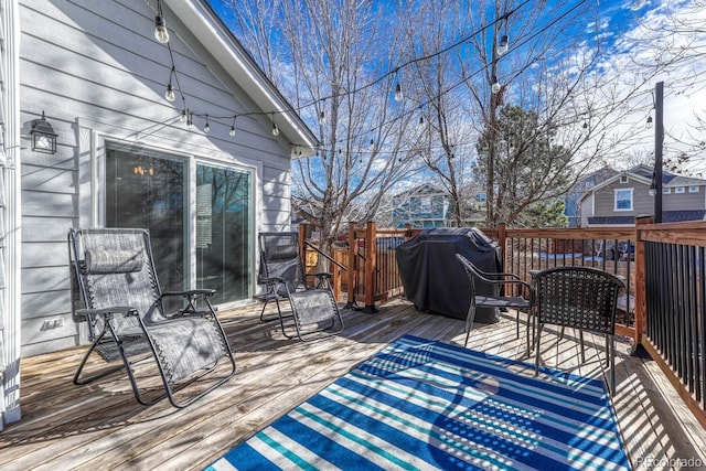 wooden deck with grilling area