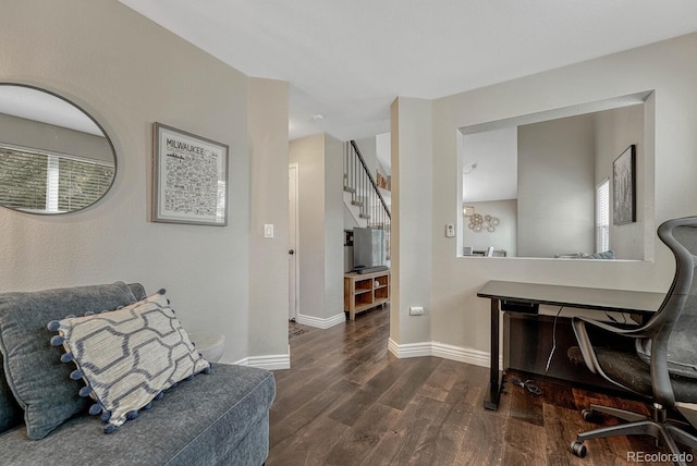 office area with baseboards and dark wood-style flooring