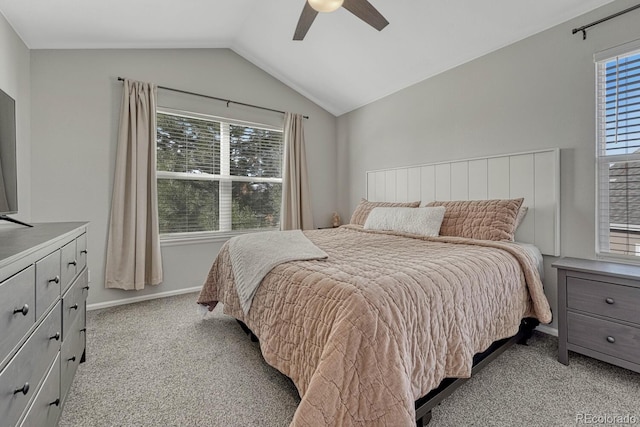 bedroom with light carpet, ceiling fan, baseboards, and lofted ceiling