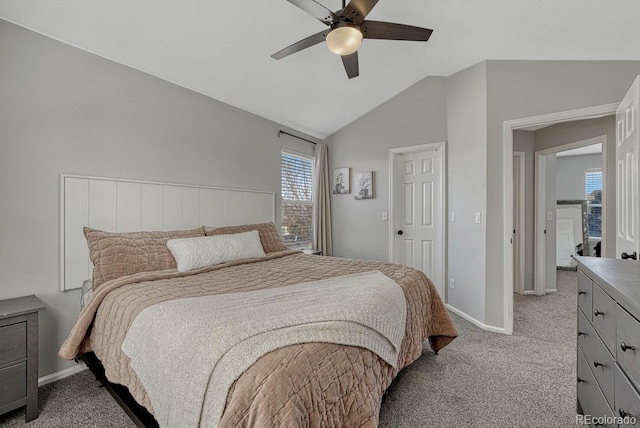 bedroom with light carpet, ceiling fan, lofted ceiling, and baseboards