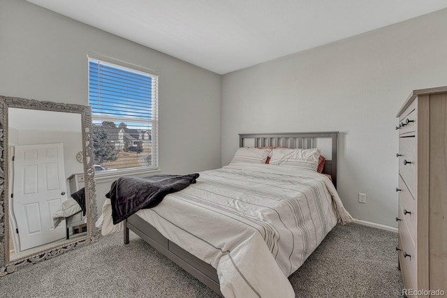 carpeted bedroom with baseboards