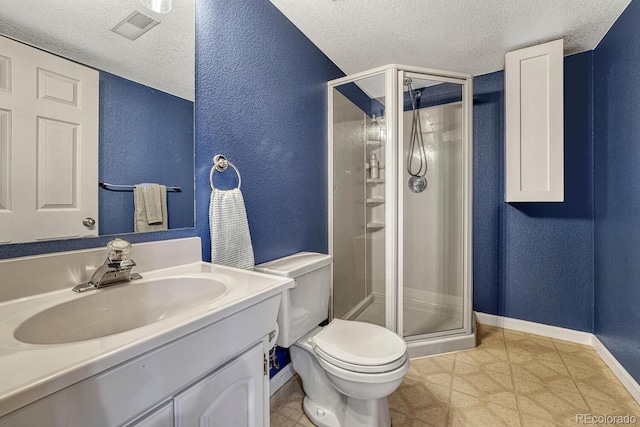 full bath with a textured wall, toilet, a stall shower, a textured ceiling, and vanity