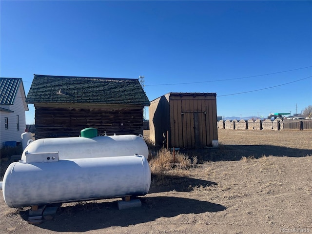 view of side of property featuring a shed