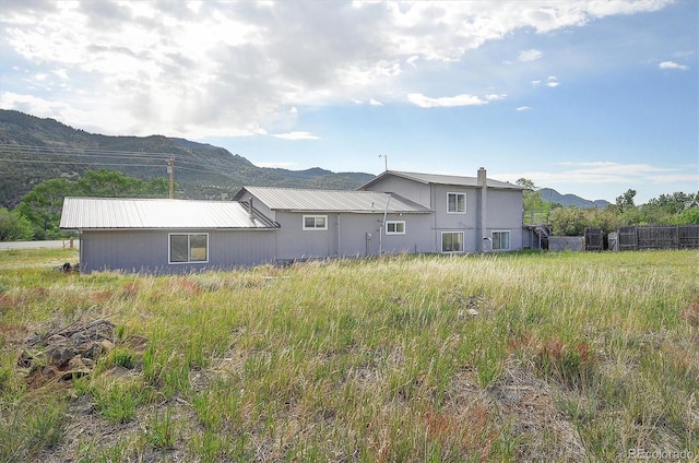 35805 US Highway 24, Buena Vista, CO 81211 - back of house with a mountain view and a metal roof