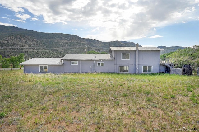 35805 US Highway 24, Buena Vista, CO 81211 - rear view of property featuring a mountain view and a metal roof