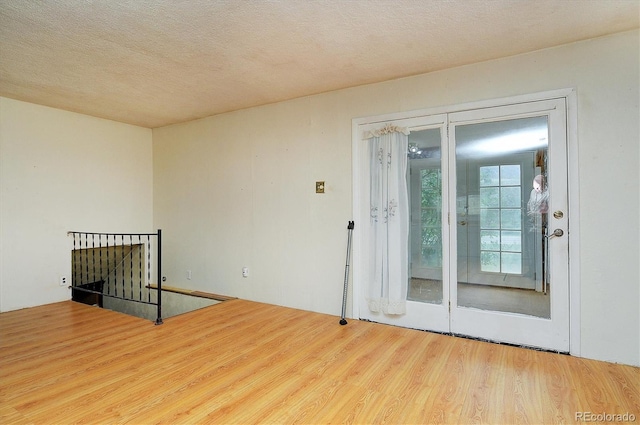 35805 US Highway 24, Buena Vista, CO 81211 - empty room featuring wood finished floors and a textured ceiling
