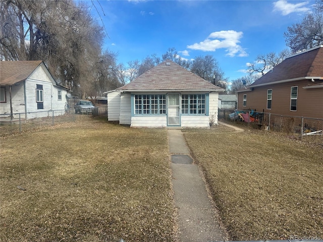 exterior space with a lawn and fence private yard