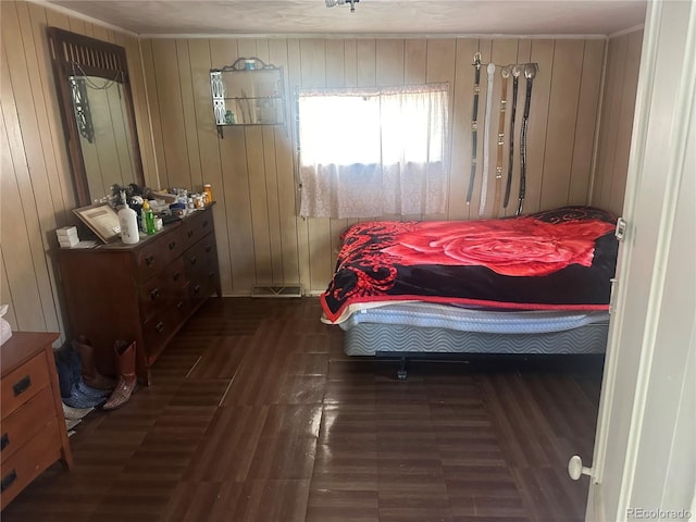 bedroom featuring wood finished floors and visible vents