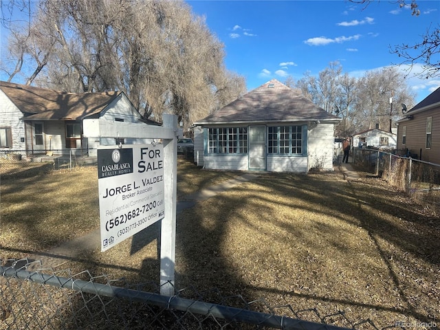 exterior space featuring a yard and fence